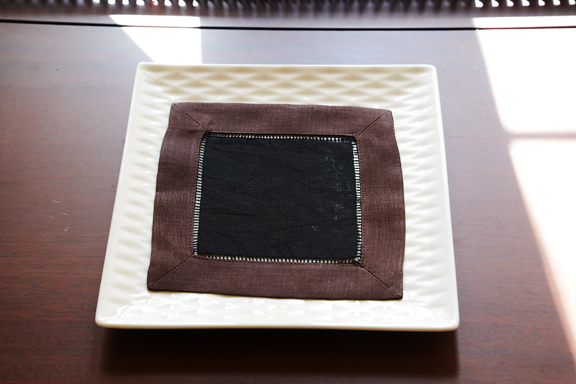 6x6 cocktail napkin, black with brown border