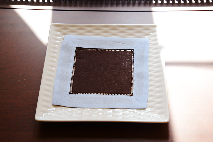cocktail napkin, 6x6". brown with light blue border